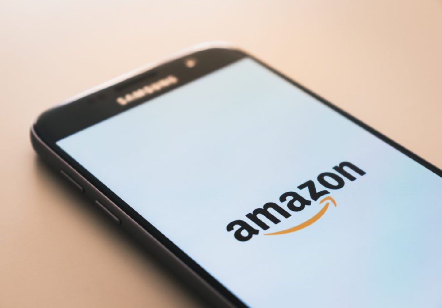 image of an iPhone with the Amazon logo on its screen