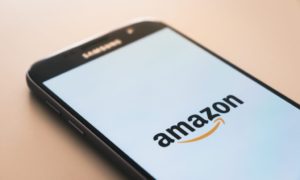 image of an iPhone with the Amazon logo on its screen